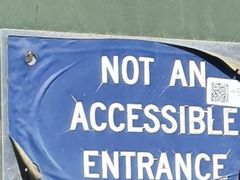 Photo of a damaged entrance sign