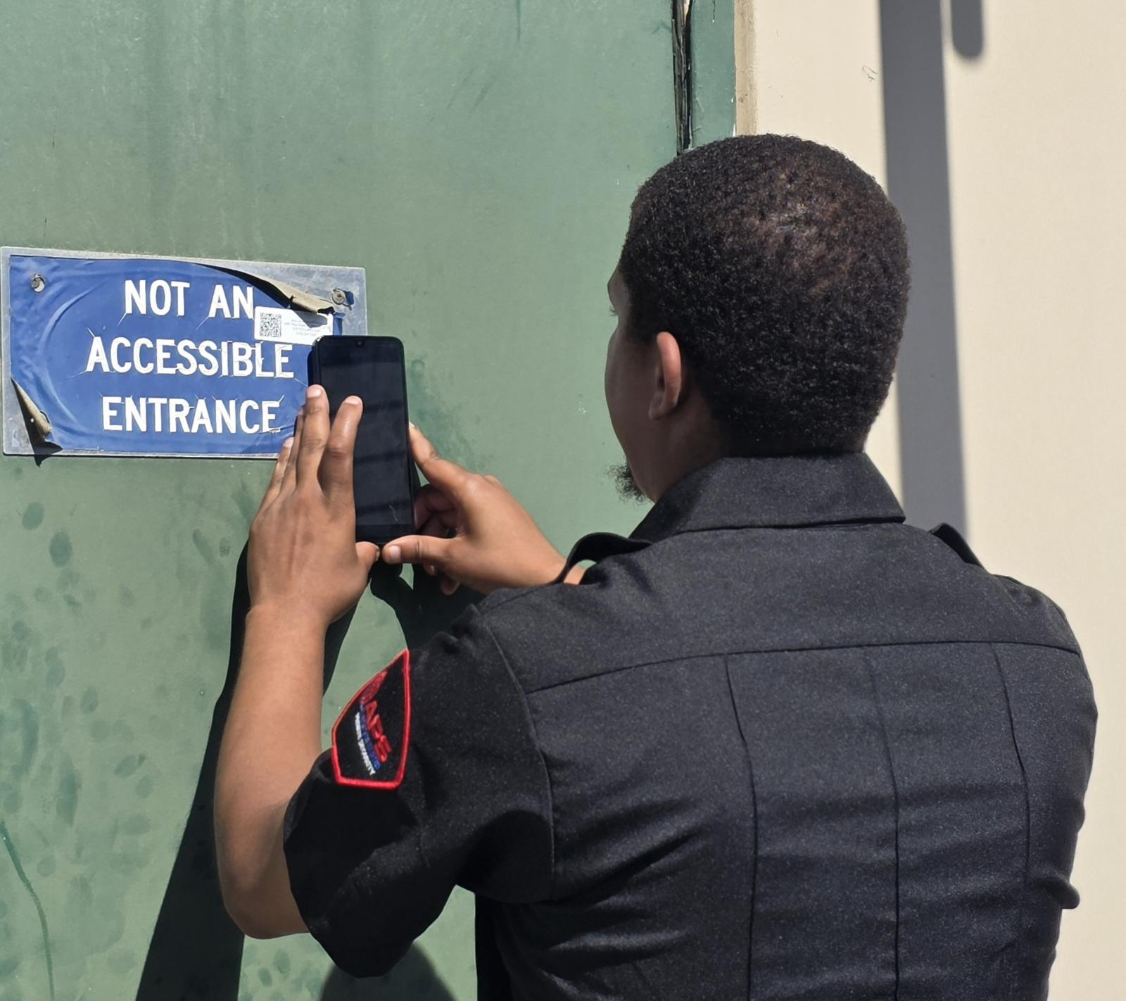 APS guard taking a photo report during patrol